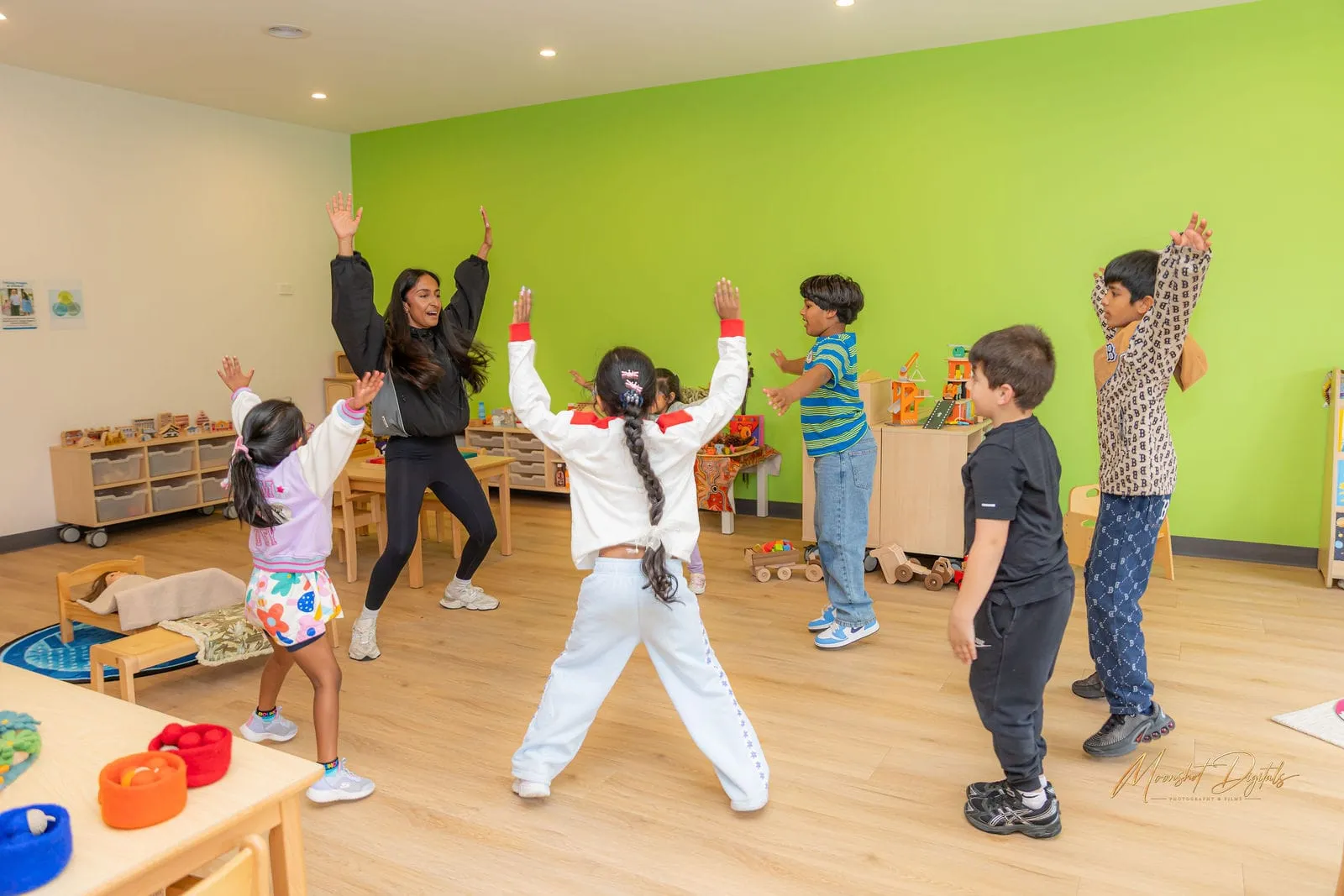 Children dancing in the green room, at the YoMy Sunshine grand opening in Dandenong North