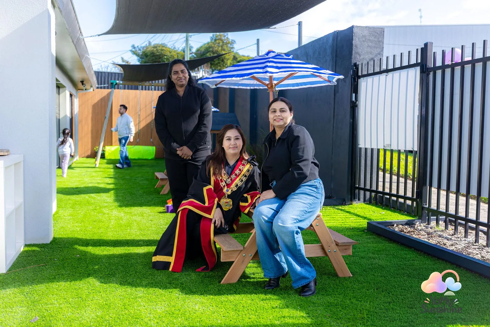 Families relaxing in the outdoor area, at the YoMy Sunshine grand opening in Dandenong North