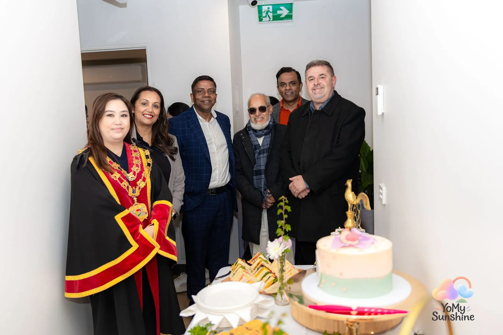 Gathering for the cake cutting, at the YoMy Sunshine grand opening in Dandenong North