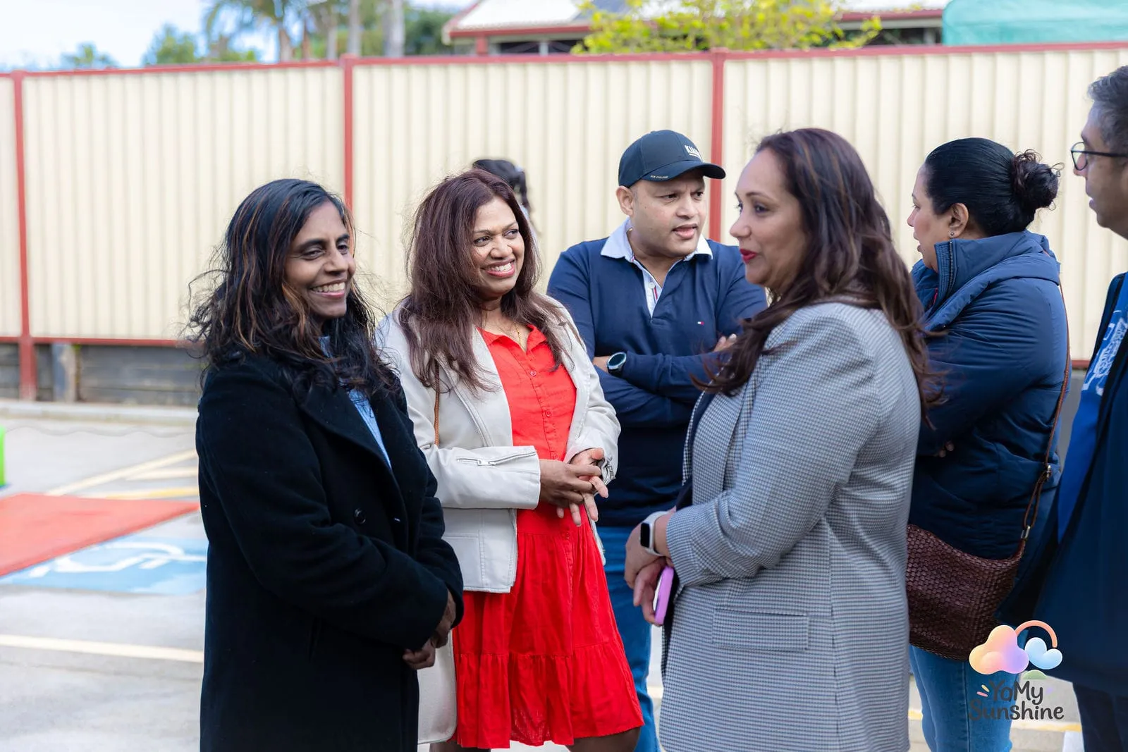 Guests chatting outside, at the YoMy Sunshine grand opening in Dandenong North