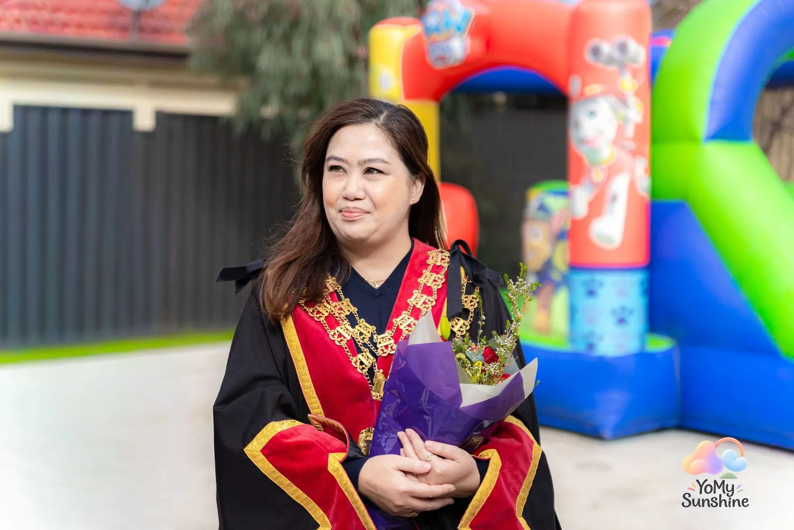 The Mayor with flowers, at the YoMy Sunshine grand opening in Dandenong North