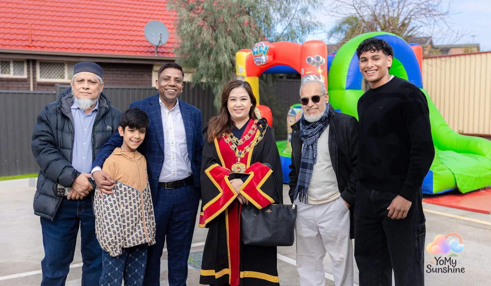 The Mayor with families, at the YoMy Sunshine grand opening in Dandenong North
