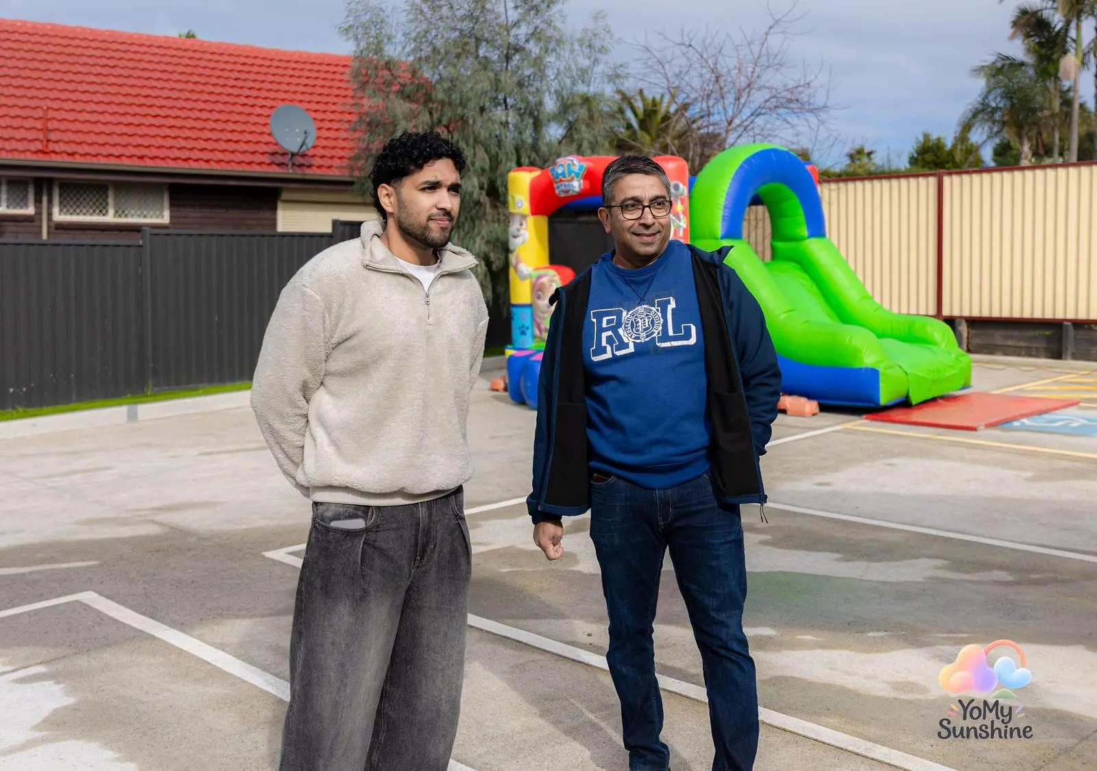 Guests by the jumping castle, at the YoMy Sunshine grand opening in Dandenong North