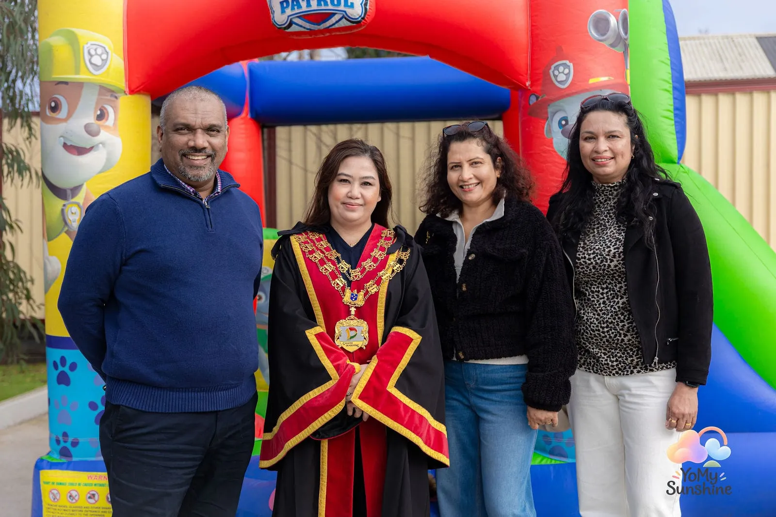 The Mayor and guests at the jumping castle, at the YoMy Sunshine grand opening in Dandenong North