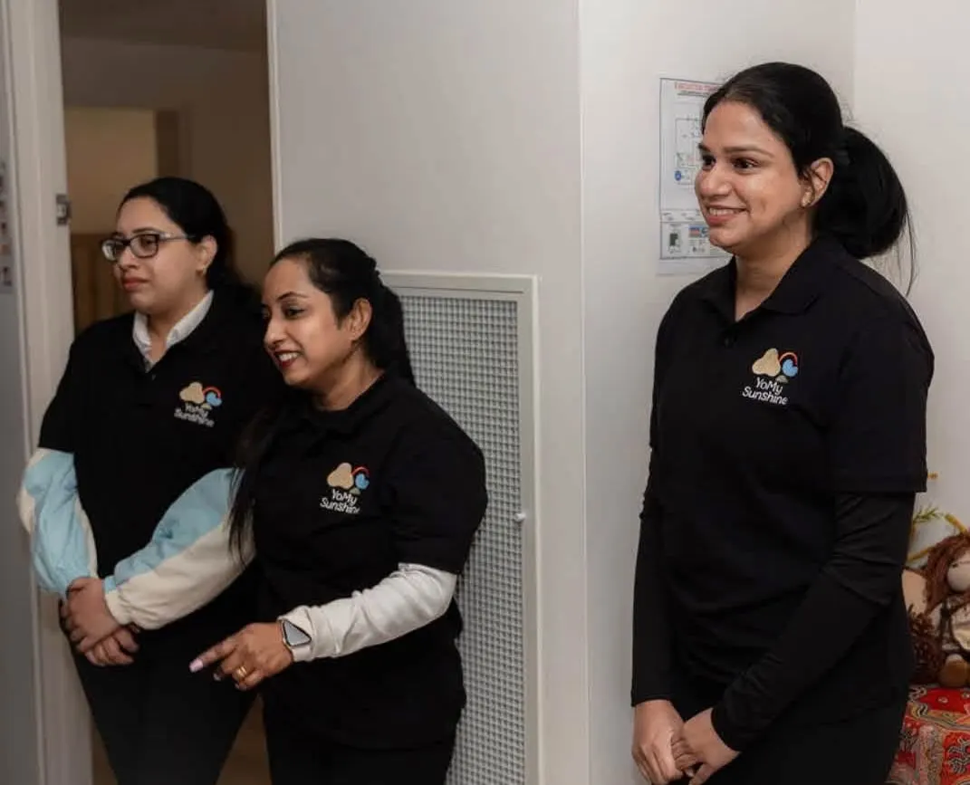 YoMy Sunshine educators in black centre polo shirts, ready to welcome families